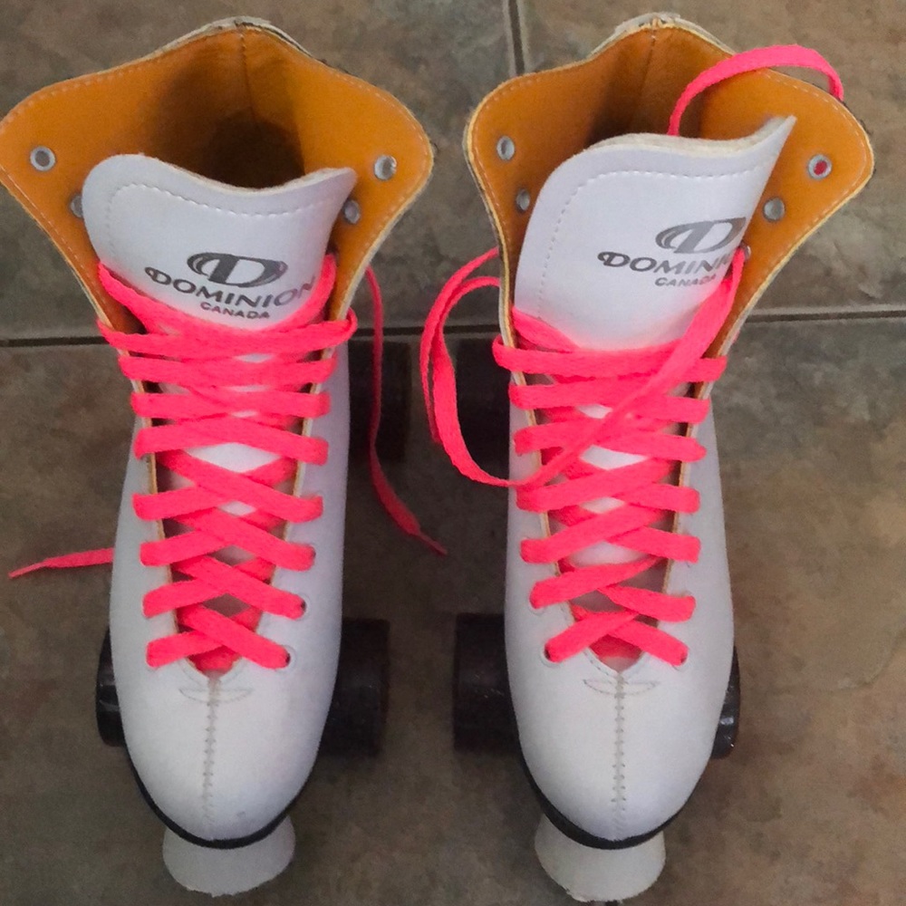 White and pink laced roller skates